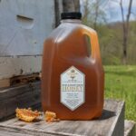 Queens Hive 12 lb raw honey jug lifestyle product photo